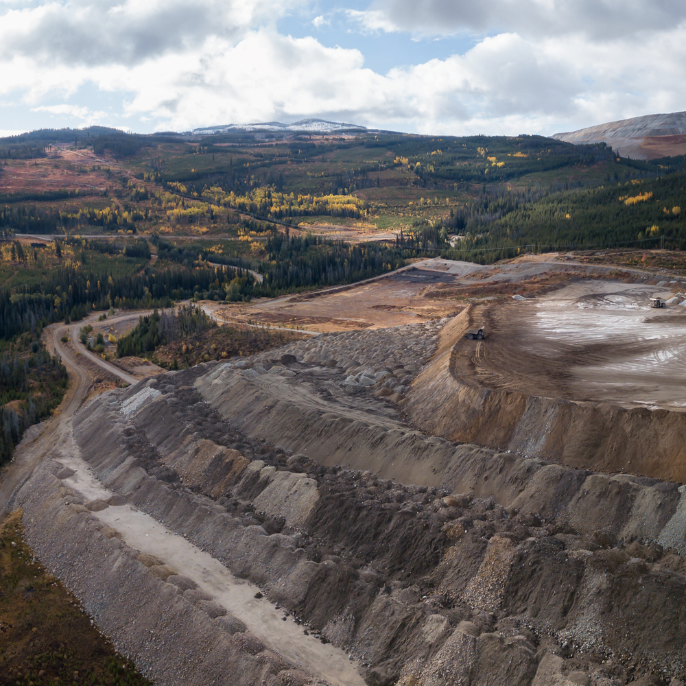Aerial view of a large-scale mining operation altering the landscape